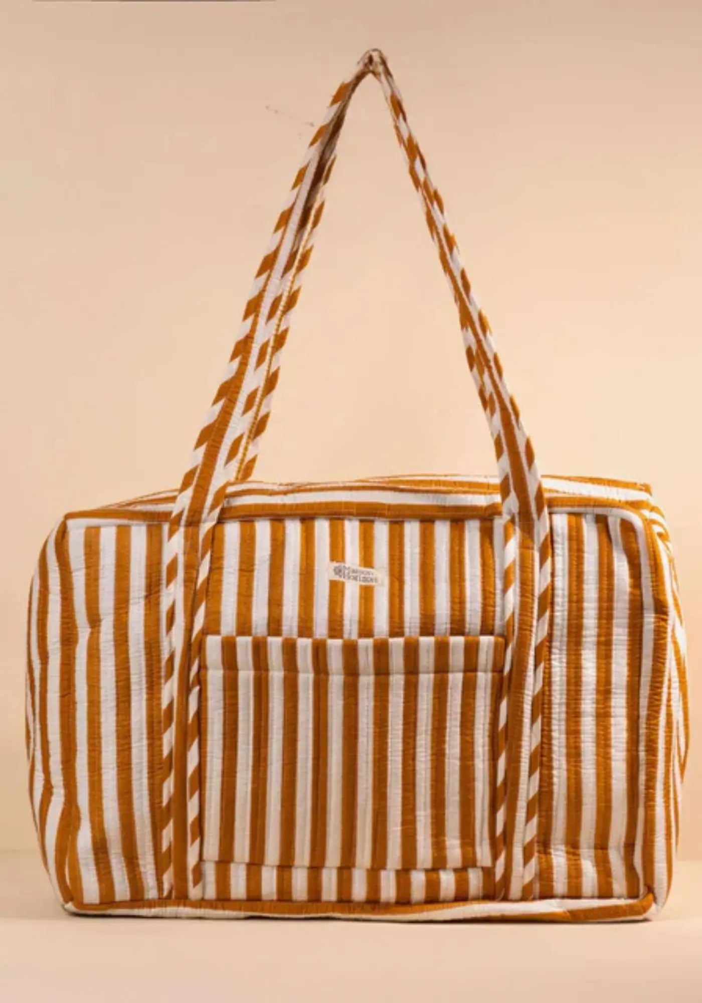 Le sac week-end ou à langer rayé moka de chez Maison Horizon 