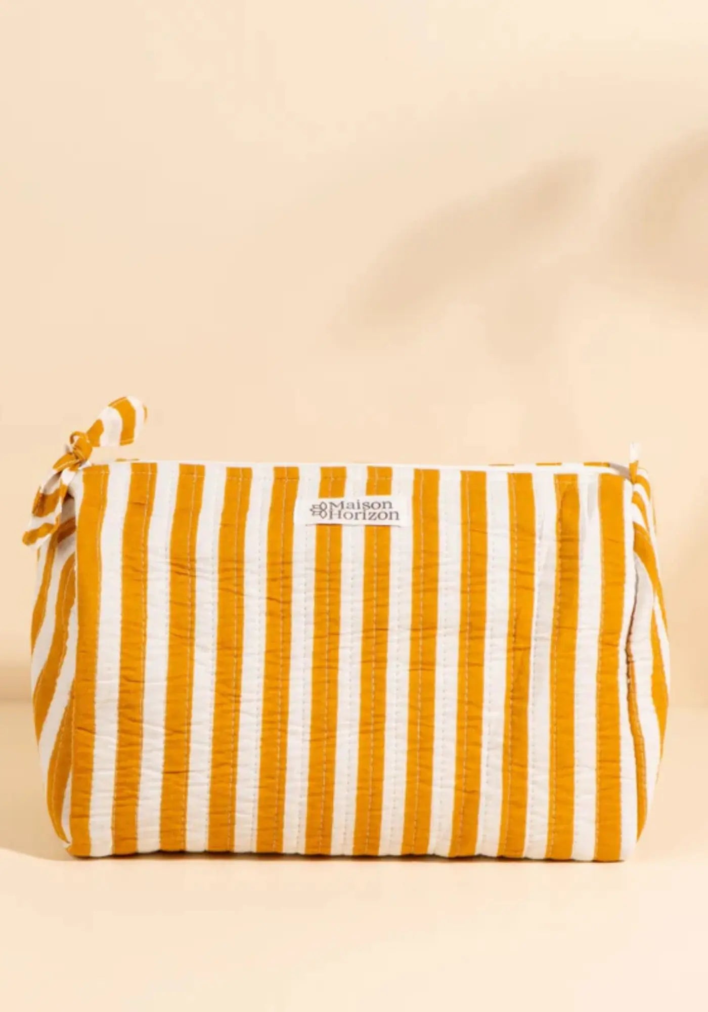 La trousse de toilette banita rayé moka de chez Maison Horizon